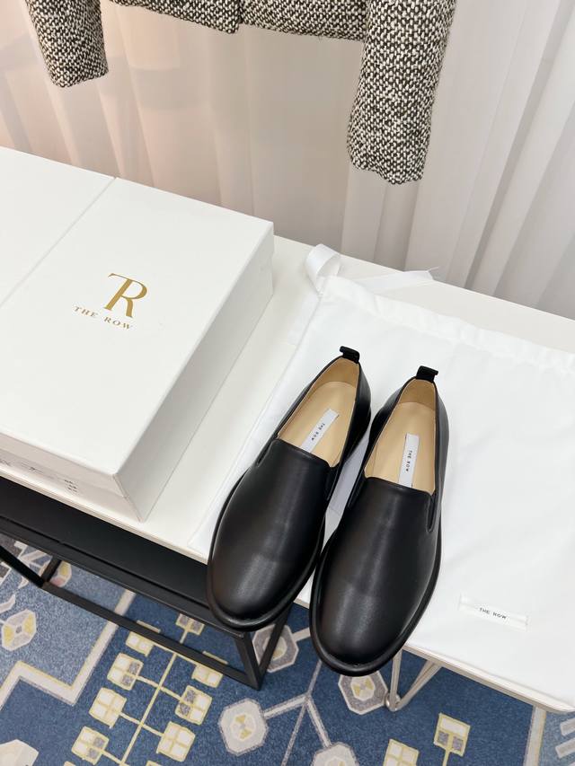 The Row's latest minimalist cowhide slip-on loafers. DDD. This brand uses the fi