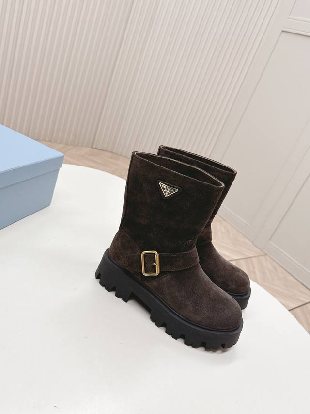 Prada's classic triangle logo slip-on boots are the ultimate women's boots. Thes