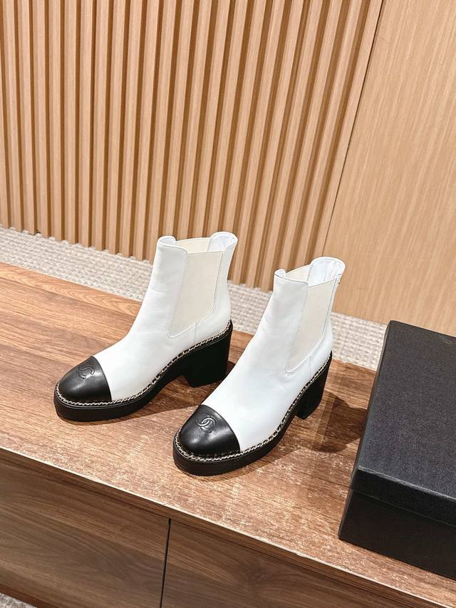 Chanel's new block-heeled ankle boots with chain-stitching. DDD. This thick-sole