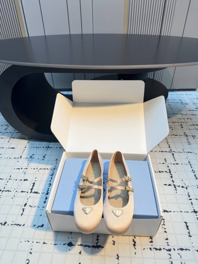 Prada round-toed Mary Jane ballet flats DDD. Decorated with a metal triangular e