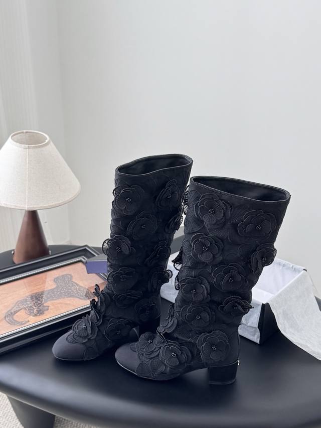 Chanel 25P new Camellia boots DDD. Each delicate flower is embellished with a ti