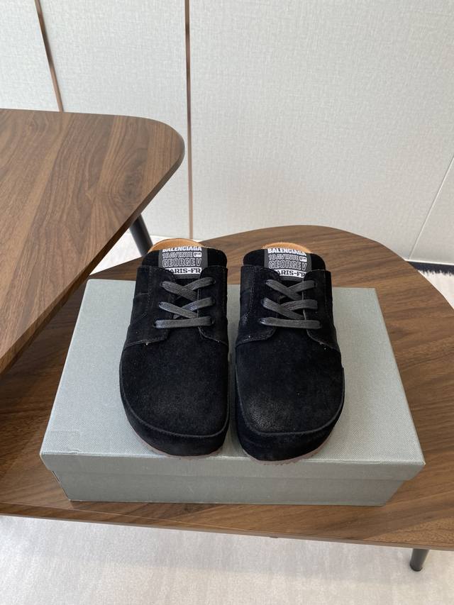 Balenciaga and Birkenstock's Boston closed-toe soft-soled platform slippers. The