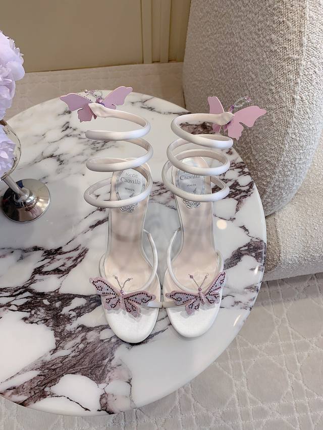 Ren* Caovill* Classic snake-wrapped high-heeled sandals are beautifully handcraf