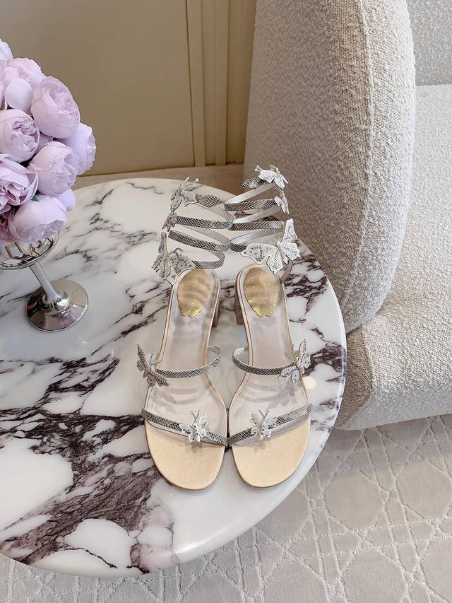 Ren* Caovill* Classic snake-wrapped high-heeled sandals are beautifully handcraf