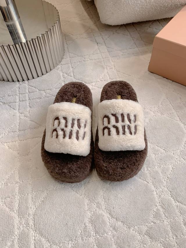 Miu's new furry platform slippers are made of super thick Australian wool. They