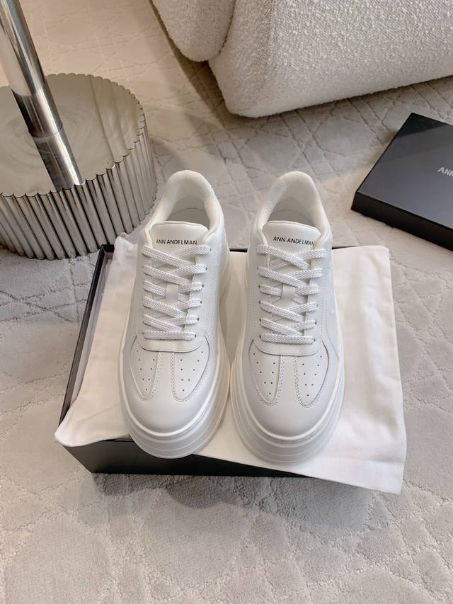 Ann Andelma*'s new thick-soled white shoes. The thick sole design has a built-in