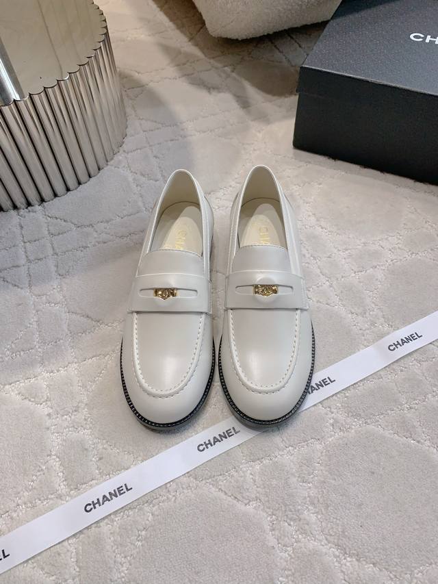 Chane*'s new gold coin loafers feature a timeless classic silhouette with a doub