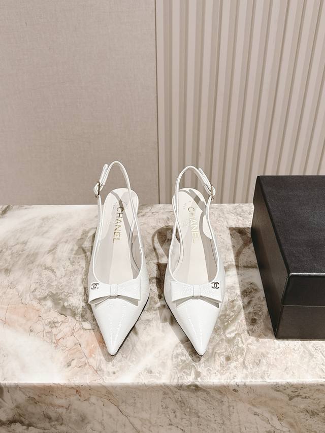 225 Chanel's new summer collection of patent leather pointed-toe loafers. They l