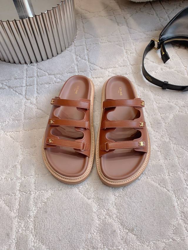 Celin*'s new platform slippers feature classic logo buckle embellishments, simpl