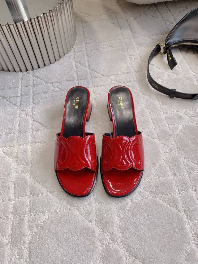 Celin*'s new block-heeled sandals feature classic logo buckle embellishments, si
