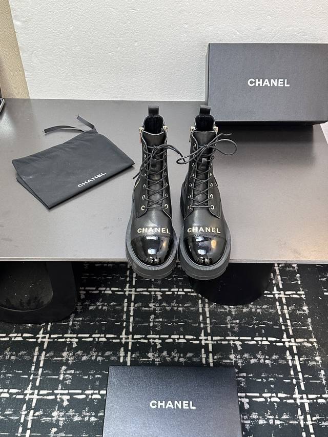 Chanel's new double-zippered ankle boots with lettering, high-end design, and a