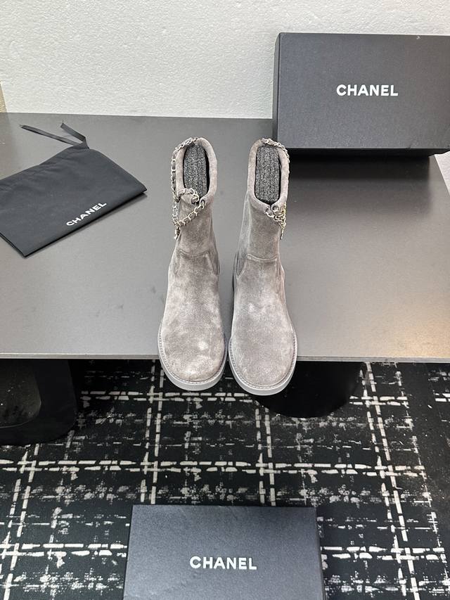 Chanel's new autumn/winter 25B Four-Leaf Clover Double C chain ankle boots. The