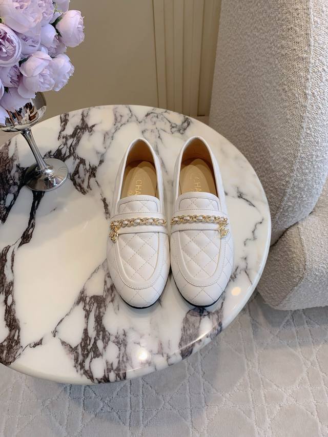 Chane*'s new rhinestone chain loafers are a timeless silhouette with a double C