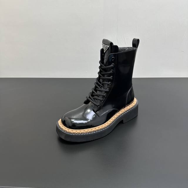 Prada's inverted triangle logo platform lace-up ankle boots are super flattering
