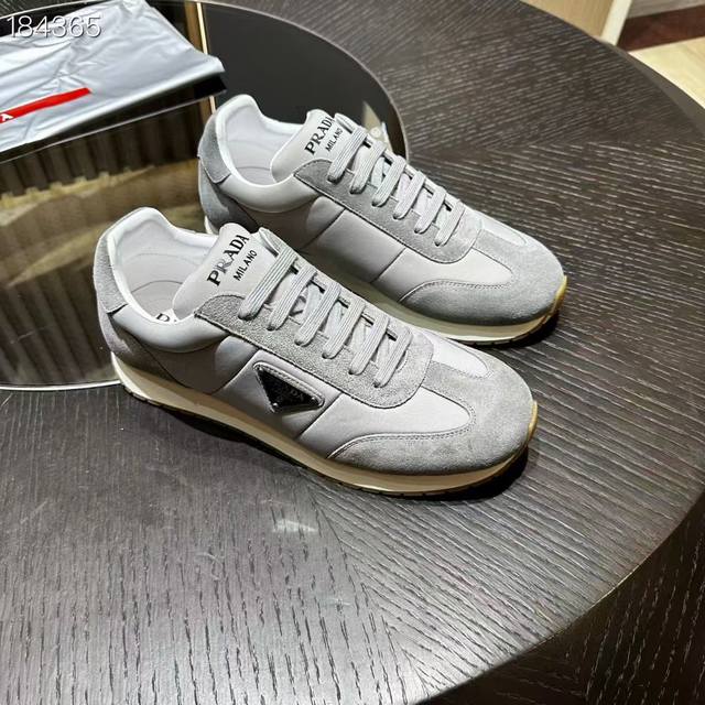 prada Retro-inspired leather sneakers are versatile and casual, featuring a ligh