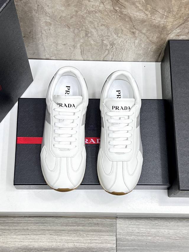 Prada Rank leather sneakers. These versatile and casual shoes are crafted from
