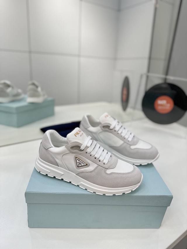 Factory price Prada new spring/summer triangle logo sneakers . High-gloss and