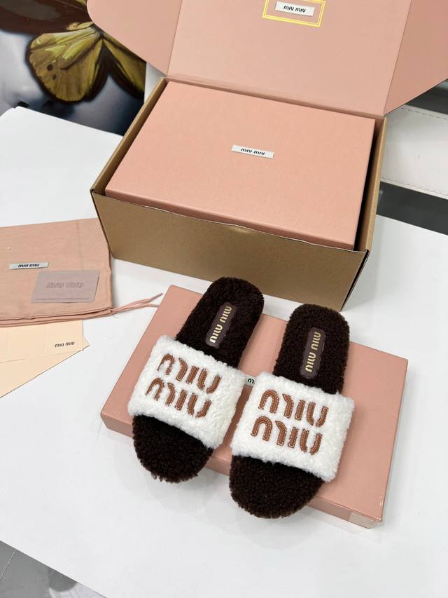 miumiu flat fur slippers. The plush material is incredibly warm and feels like s
