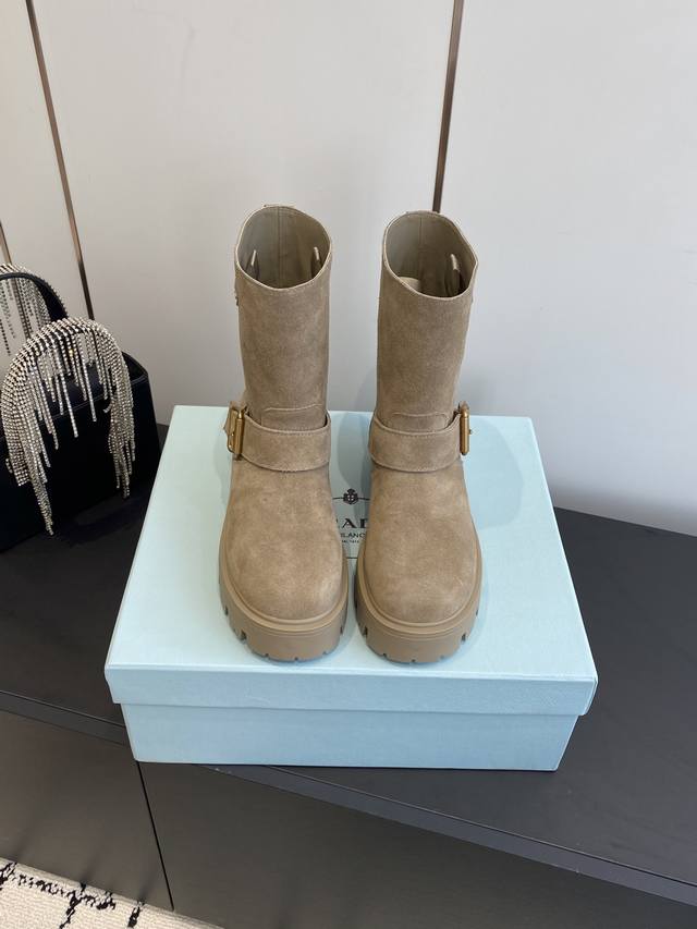 Prada classic triangle logo slip-on boots . This winter collection is unavaila