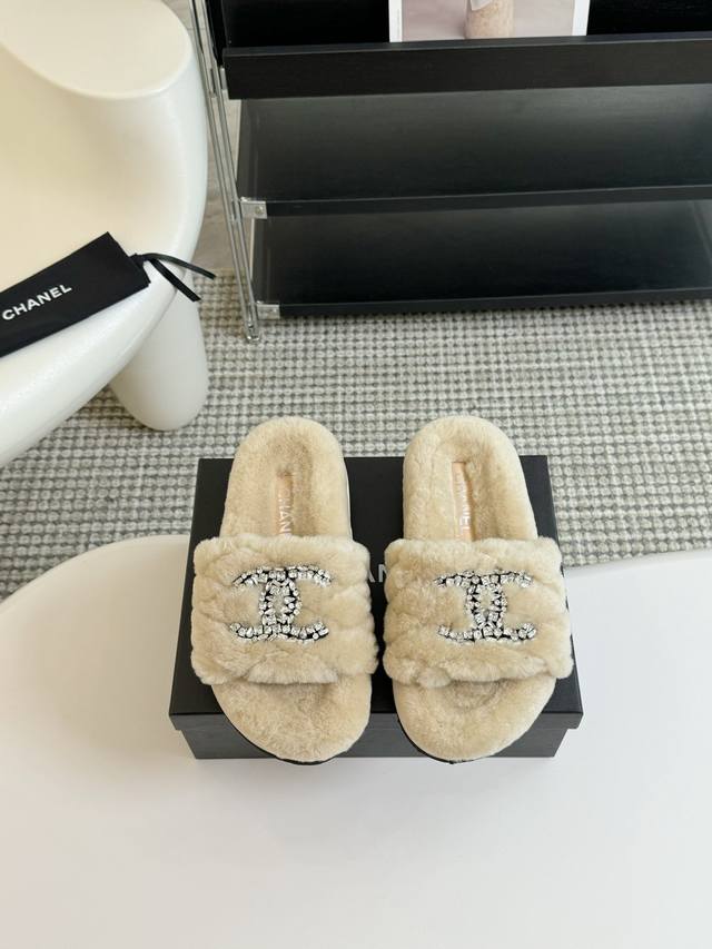 Chanel's classic autumn/winter thick-soled rhinestone furry slippers. There are
