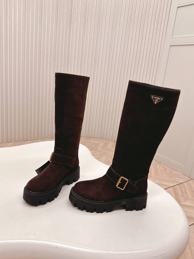 Premium-grade cowhide and leather upper. Prada's classic triangle-shaped slip-on