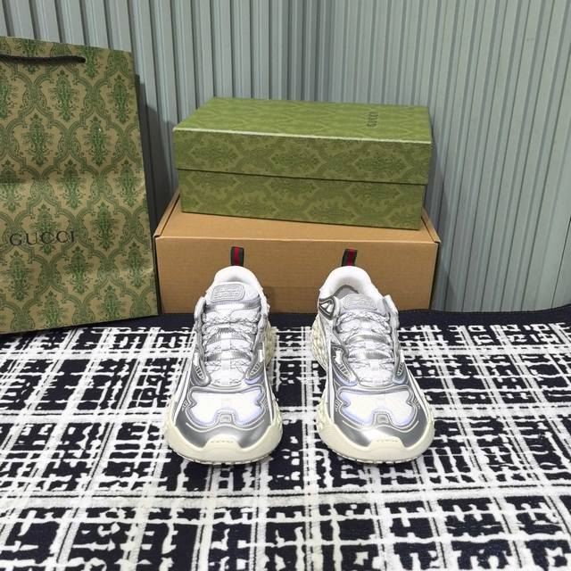 Gucci's 3D sneakers are a total hit! Available in silver, gray, and black, these