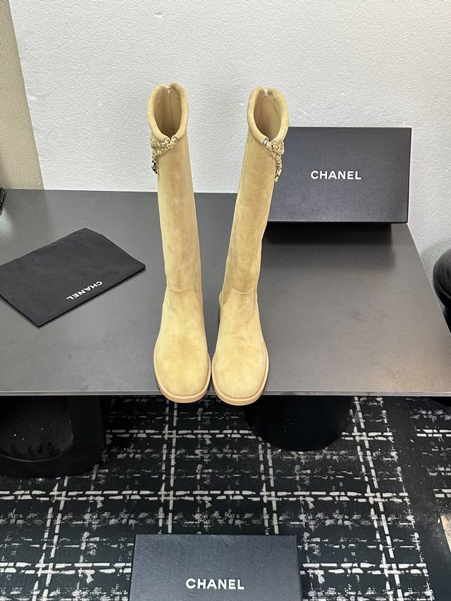 Chanel's new autumn/winter 25B Four-Leaf Clover Double C chain boots. These tall