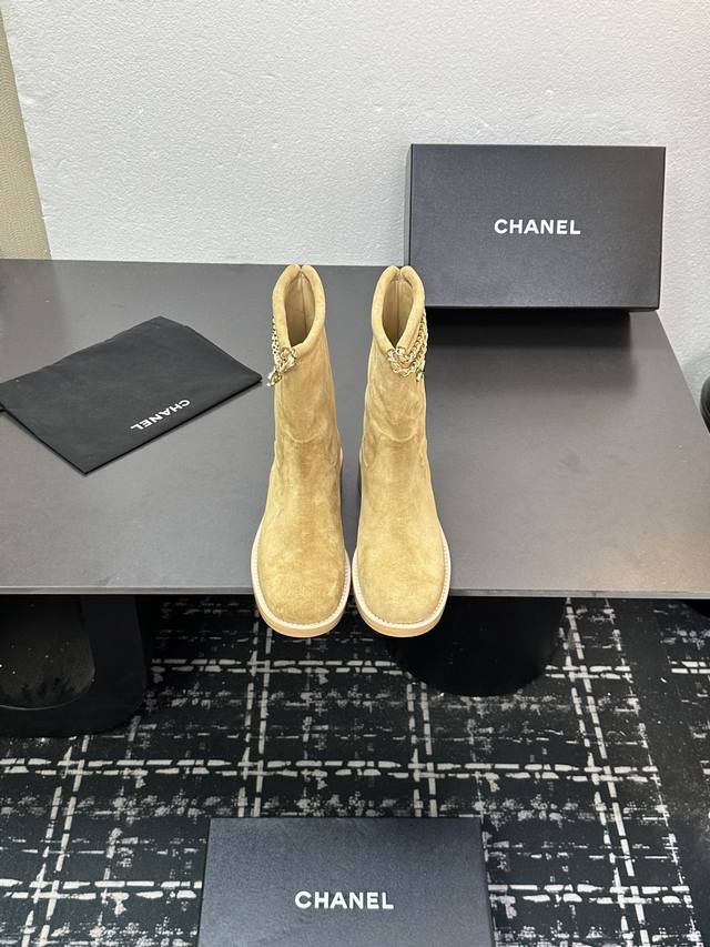 Chanel's new autumn/winter 25B Four-Leaf Clover Double C chain ankle boots. The