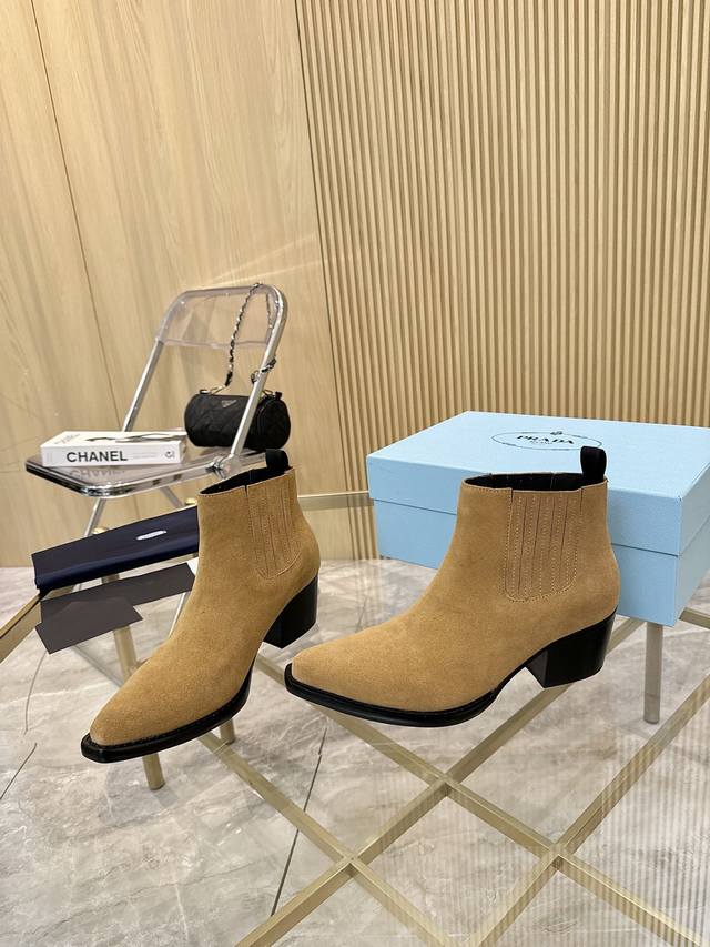 Factory-exclusive, top-of-the-line Prada classic pointed-toe boots are perfect