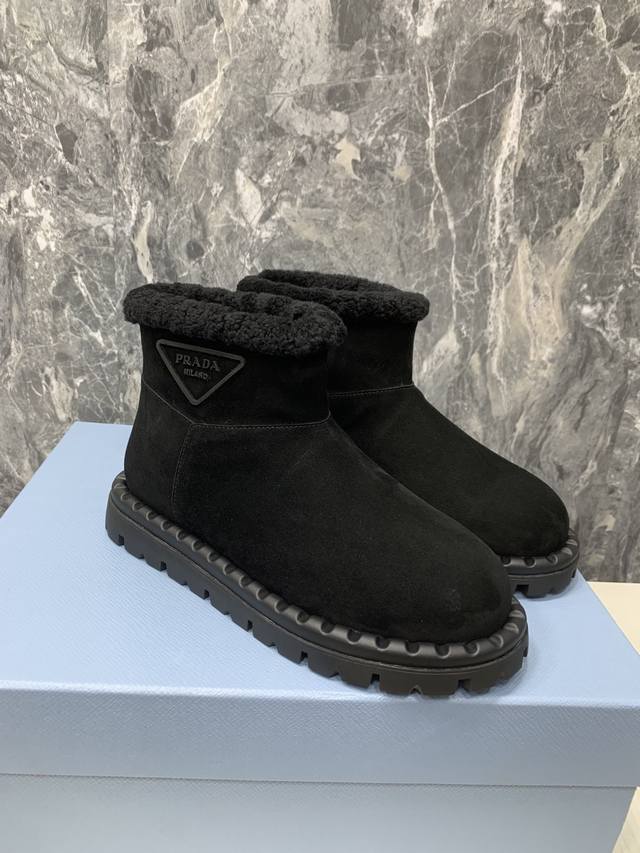 Prada's ultimate snow and ski boots are incredibly cute and chunky. From the Pr