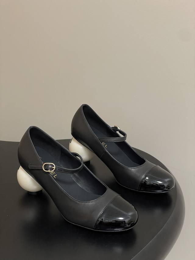 Chanel's Fall/Winter 2025 runway-inspired Double C Mary Jane pumps with giant pe