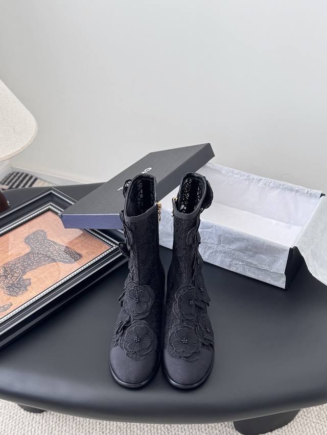 Chanel 25p new camellia ankle boots . Each delicate flower is embellished with