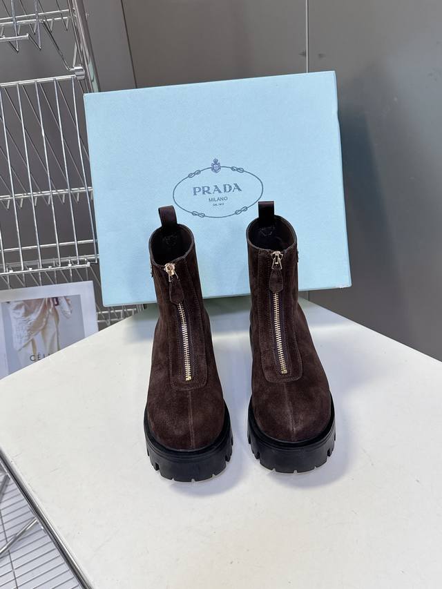 prada's latest autumn and winter triangle-label slip-on boots for women. Many ce