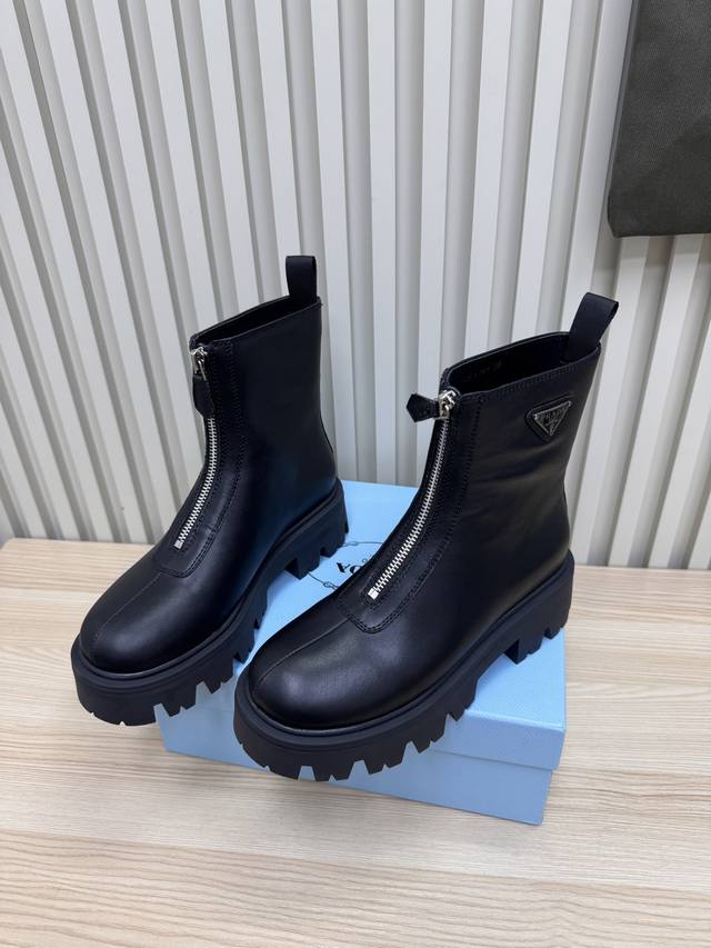 Prada's Martin boots are the coolest street style. Made from the original Prada