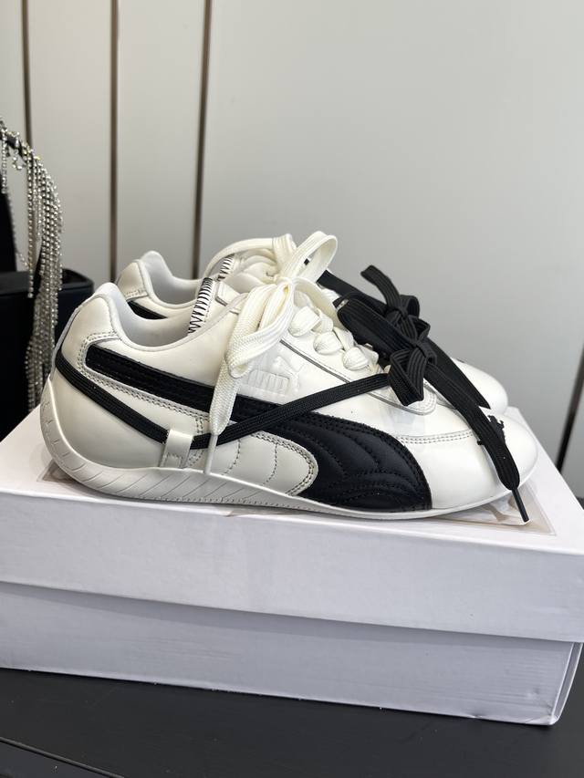 X Puma Speedcat co-branded sneakers and casual sports shoes. Both colorways are X Puma Speedcat co-branded sneakers and casual sports shoes. Both colorways are