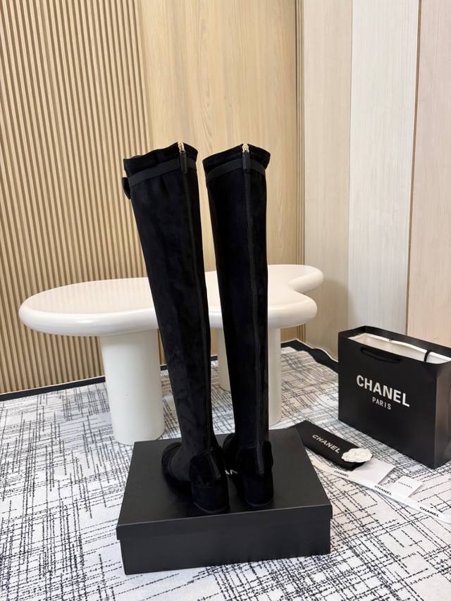 Short and tall Chanel classic block-heeled zip-up ankle boots. These boots cleve