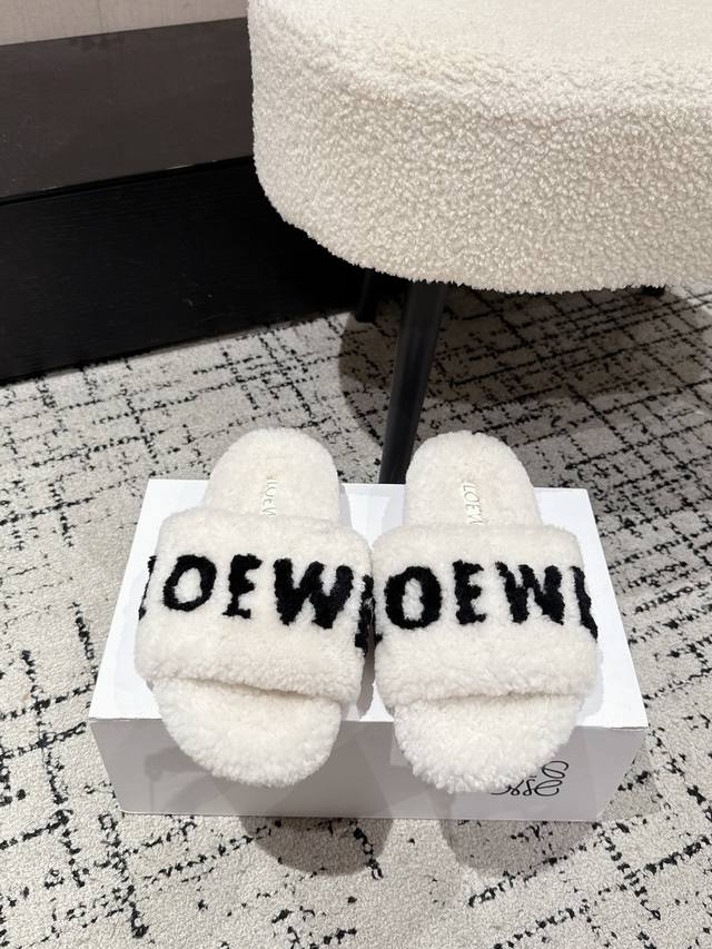 Loewe 25's latest autumn/winter furry slippers with lettering. There are so many