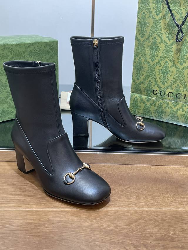 Gucci's high-end boutique, Gucci's new horsebit stretch boots for early fall. Th