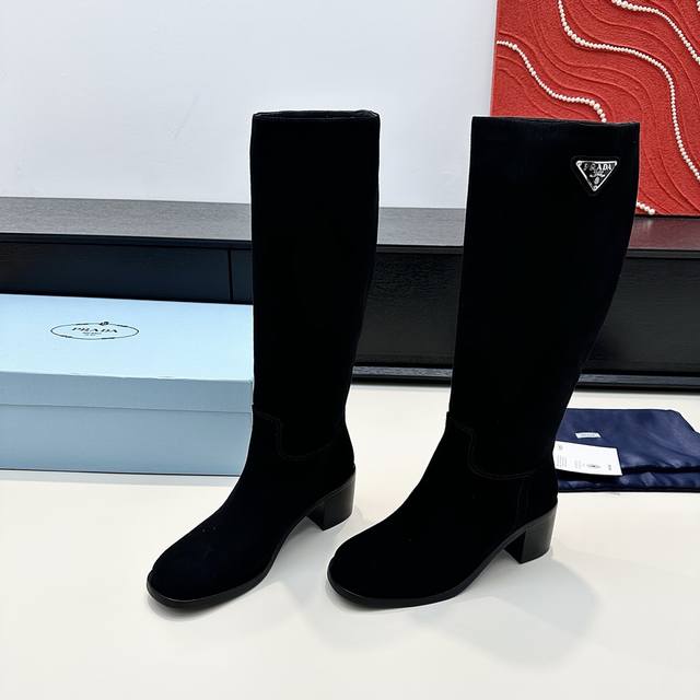 Purchased on behalf of Prada. Prada's new fall/winter suede high-heeled boots.
