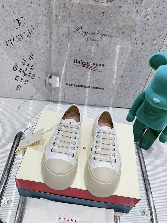 Lace-up white leather. Latest version.