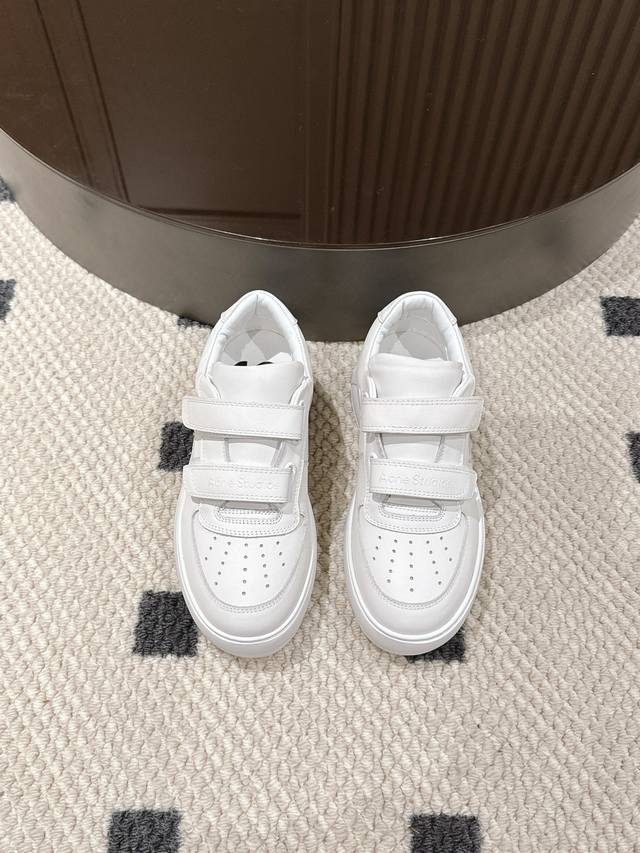 The classic Acne smiley face style never goes out of style. This Acne Studios t