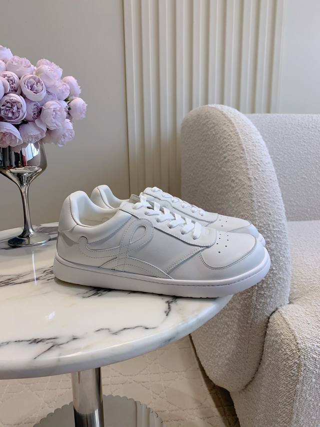 Women's and Men's Loew*'s new Jambo casual white sneakers still feature the dist