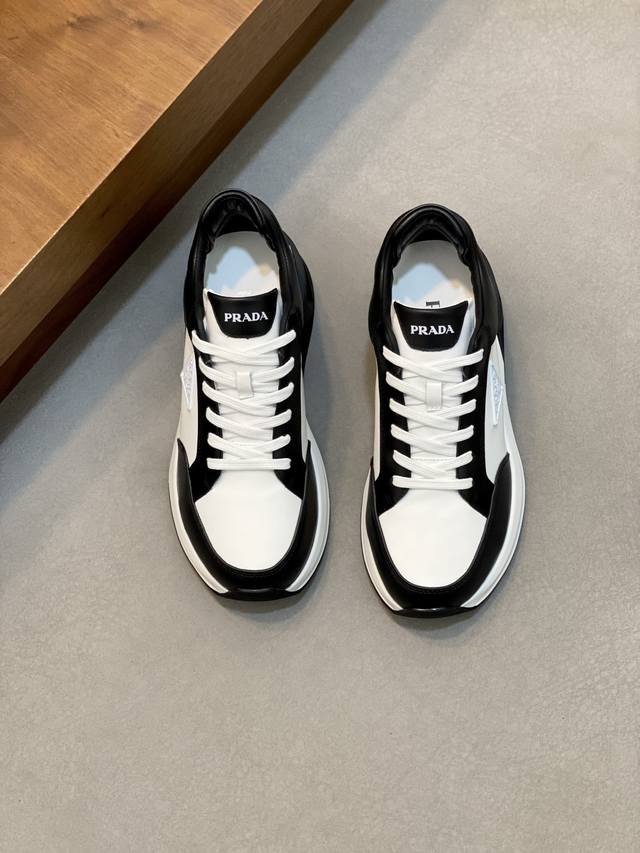 prada Prada men's new leather patchwork sneakers . These sneakers present a mod