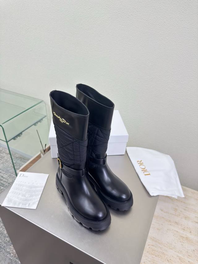 Paired with down-filled Dior knee-high boots. Thick sole with metal lettering a