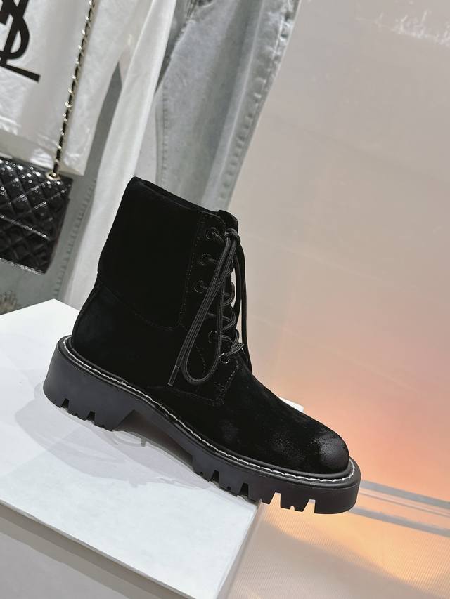 X On Loewe's new autumn/winter collection of celebrity-style Martin boots. These