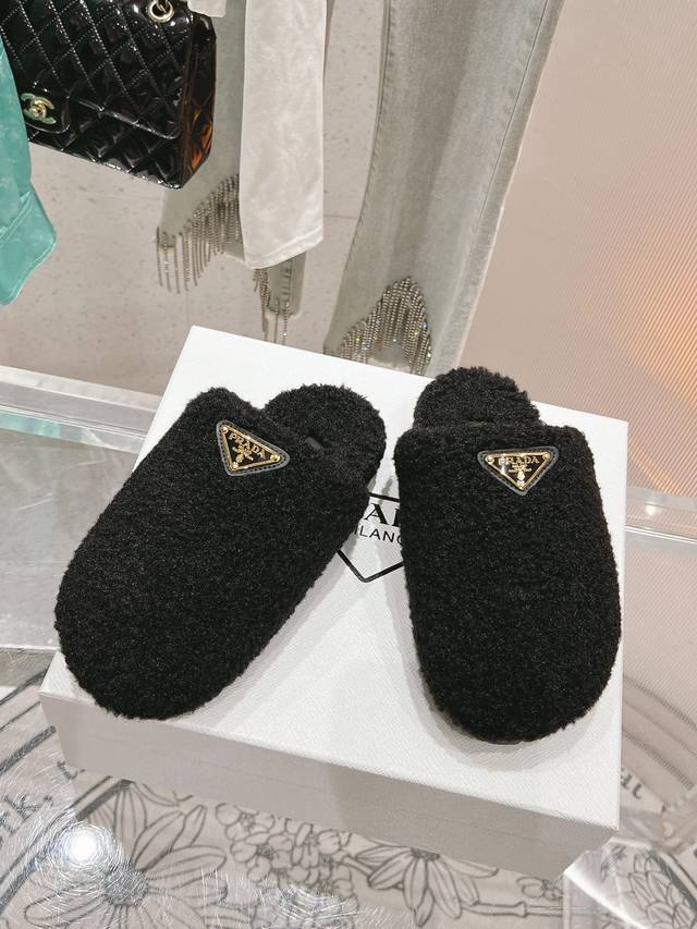 Top-of-the-line, latest hot-selling snow boots from Prada, featuring a triangle