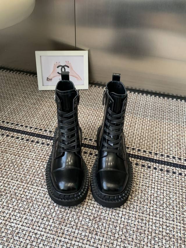 Prada's classic triangle-shaped Martin boots. This year's hot item. They're sty