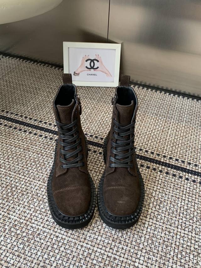 Prada's classic triangle-shaped Martin boots. This year's hottest item. They lo