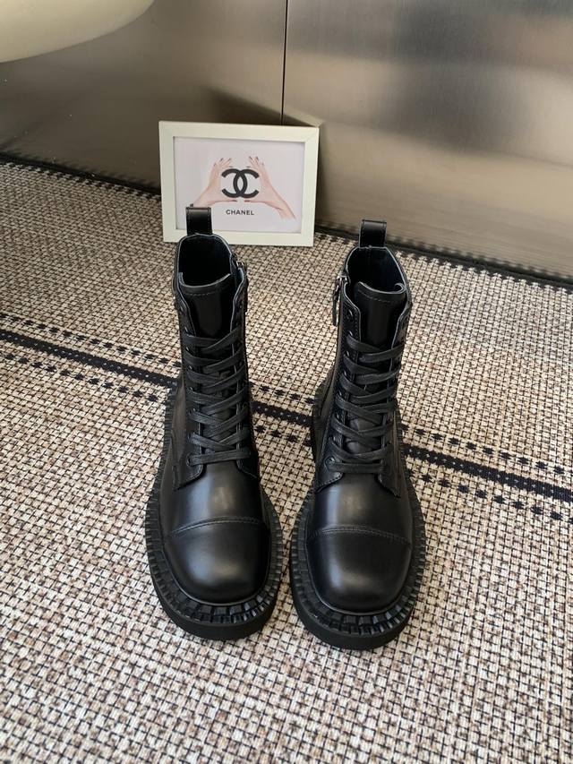 Prada's classic triangle-shaped Martin boots. This year's hot item. They look s