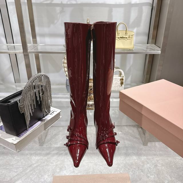 Factory-made long boots from Miumiu's autumn/winter kitten heel collection. The